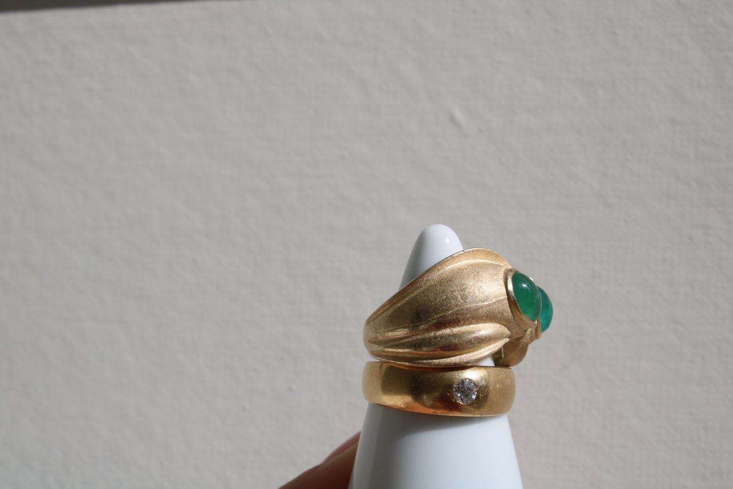 Toi et moi rings: the most romantic of rings. Symbolizing two parts of a whole, or symbolizing the interconnected nature of our internal tensions. I think there's something scared about this type of interlocking geometry and there's an infinite world of glamour inside of this specific form. Natural Colombian emeralds nestled in nearly raw recycled 10k gold are pictured.