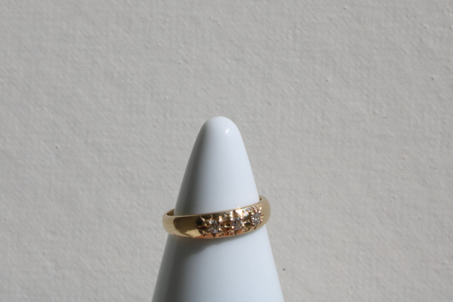 Inspired by a sweet, timeless vintage pinky ring. Three adorable diamonds starset into a perfectly stackable everyday gold ring. Solid 10k recycled gold (hallmarked) - 3 VS1 lab grown diamonds, 2mm diameter (emerald pricing available upon request.)