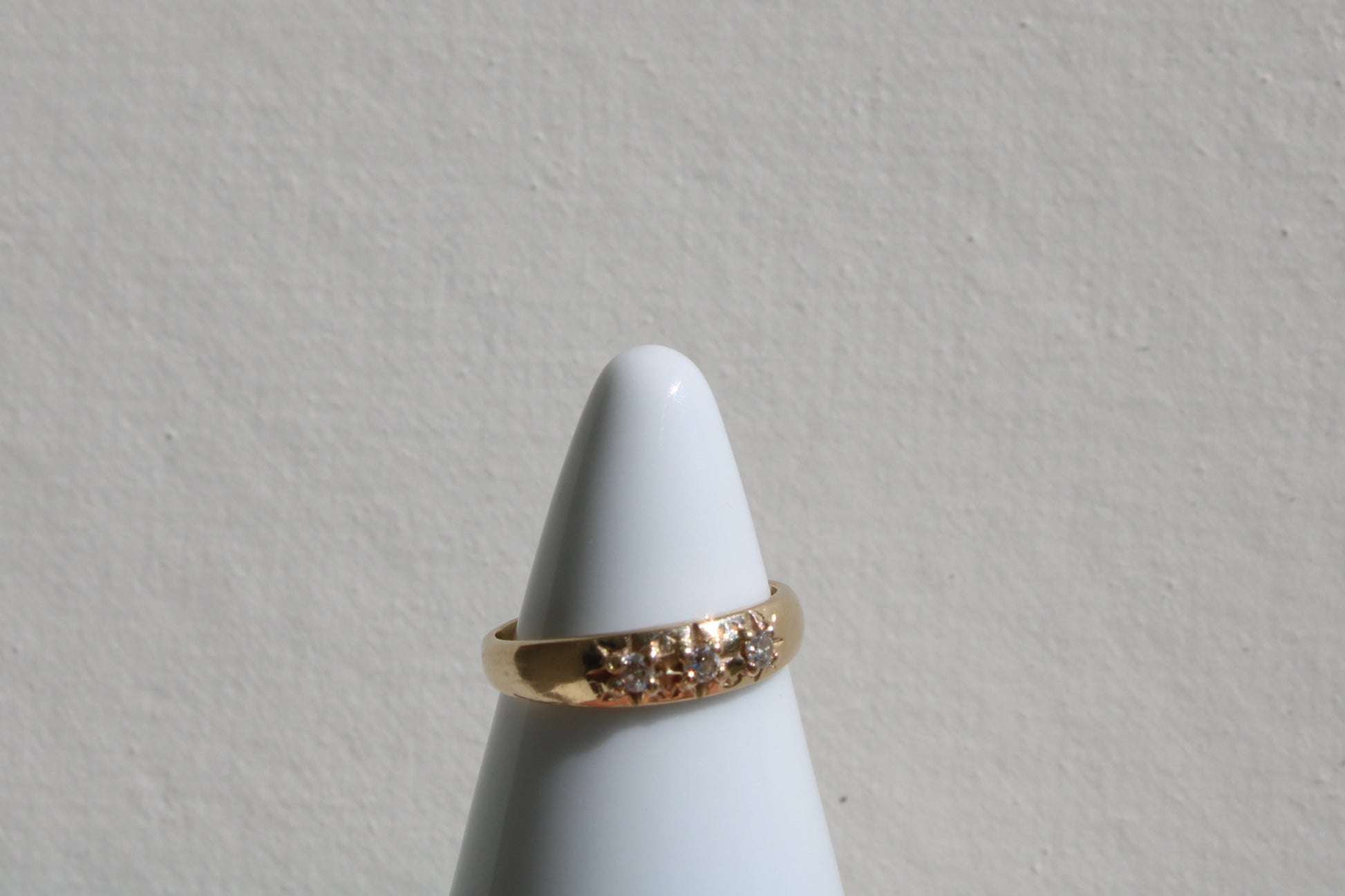 Inspired by a sweet, timeless vintage pinky ring. Three adorable diamonds starset into a perfectly stackable everyday gold ring. Solid 10k recycled gold (hallmarked) - 3 VS1 lab grown diamonds, 2mm diameter (emerald pricing available upon request.)