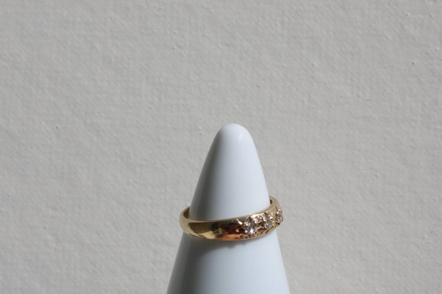 Inspired by a sweet, timeless vintage pinky ring. Three adorable diamonds starset into a perfectly stackable everyday gold ring. Solid 10k recycled gold (hallmarked) - 3 VS1 lab grown diamonds, 2mm diameter (emerald pricing available upon request.)
