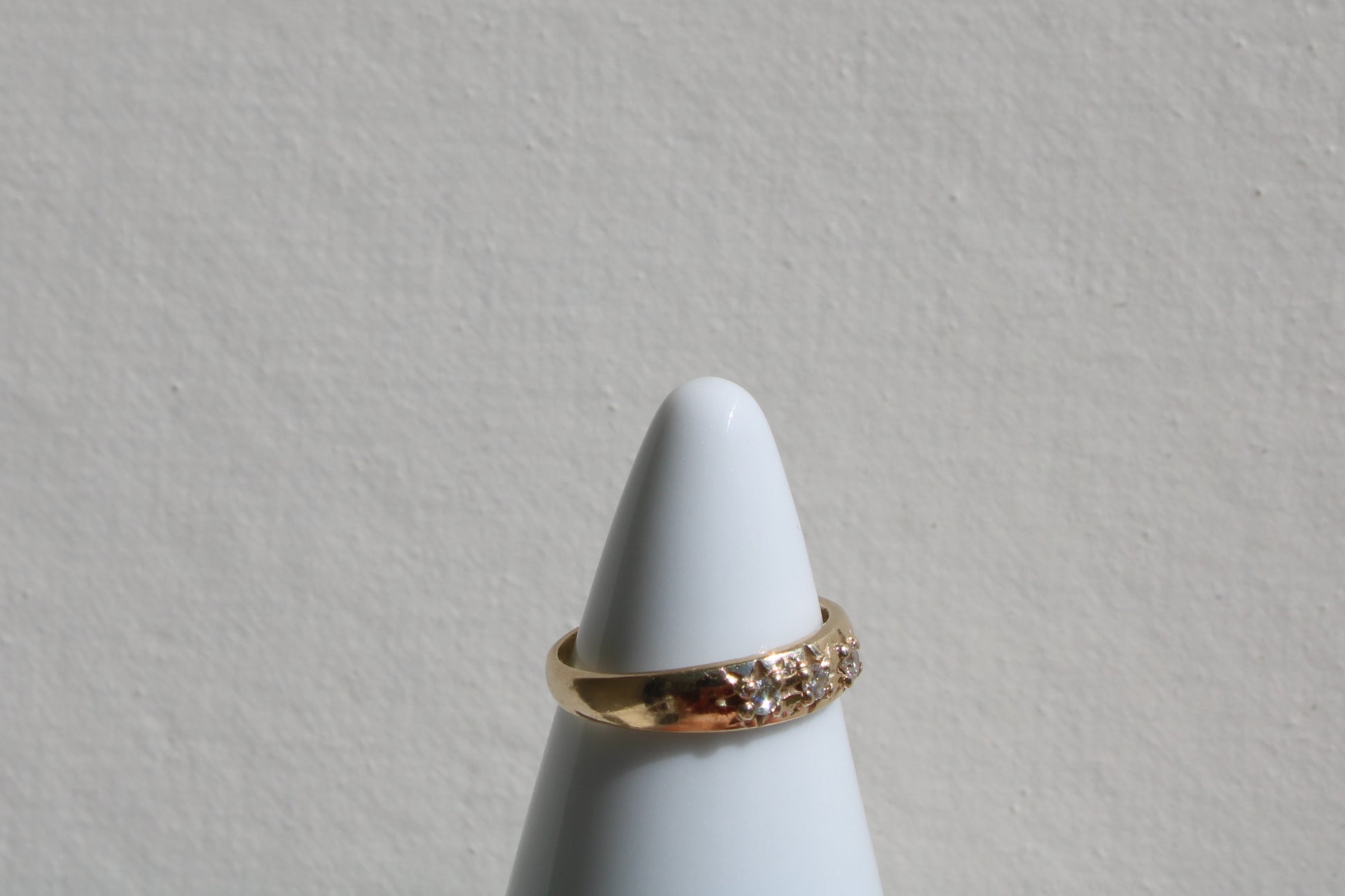 Inspired by a sweet, timeless vintage pinky ring. Three adorable diamonds starset into a perfectly stackable everyday gold ring. Solid 10k recycled gold (hallmarked) - 3 VS1 lab grown diamonds, 2mm diameter (emerald pricing available upon request.)