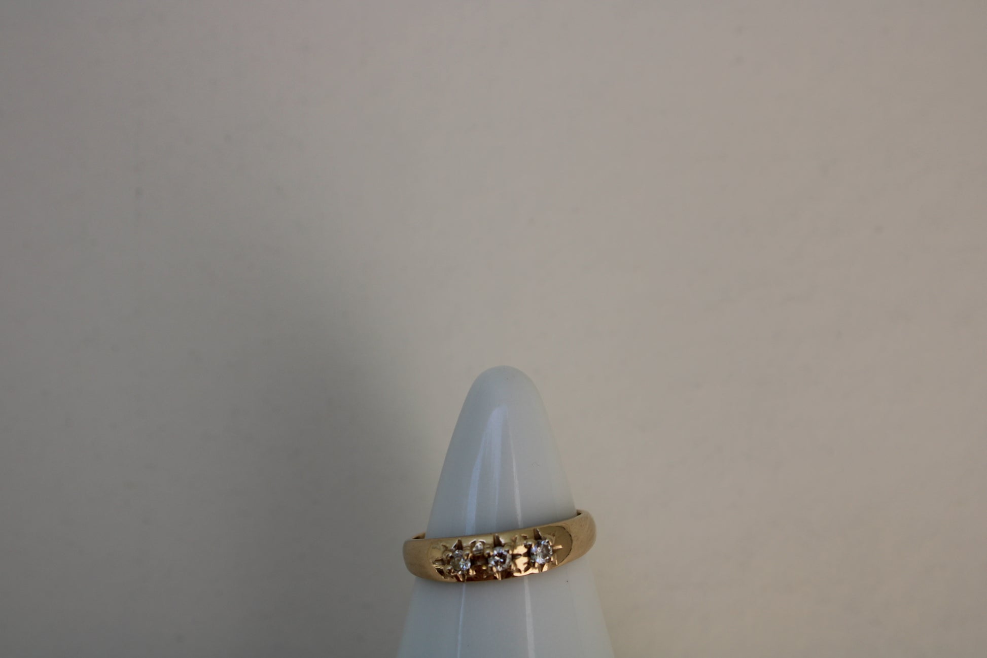 Inspired by a sweet, timeless vintage pinky ring. Three adorable diamonds starset into a perfectly stackable everyday gold ring. Solid 10k recycled gold (hallmarked) - 3 VS1 lab grown diamonds, 2mm diameter (emerald pricing available upon request.)