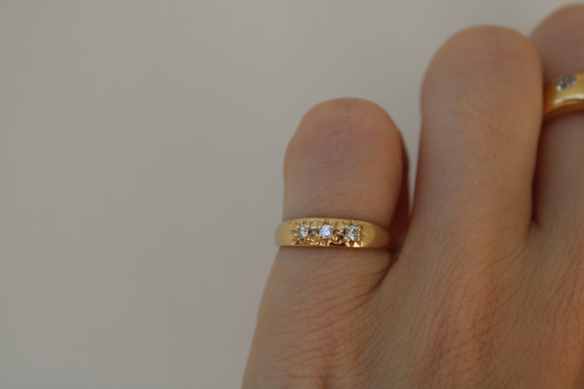 Inspired by a sweet, timeless vintage pinky ring. Three adorable diamonds starset into a perfectly stackable everyday gold ring. Solid 10k recycled gold (hallmarked) - 3 VS1 lab grown diamonds, 2mm diameter (emerald pricing available upon request.)