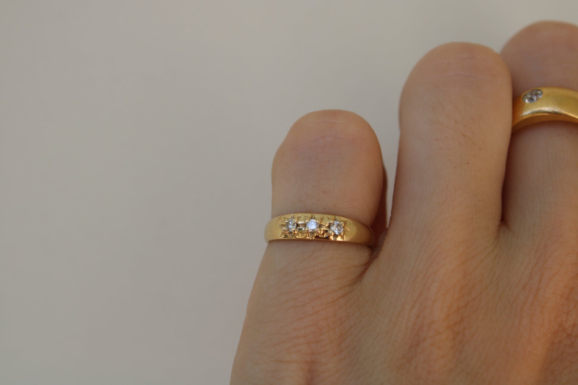 Inspired by a sweet, timeless vintage pinky ring. Three adorable diamonds starset into a perfectly stackable everyday gold ring. Solid 10k recycled gold (hallmarked) - 3 VS1 lab grown diamonds, 2mm diameter (emerald pricing available upon request.)