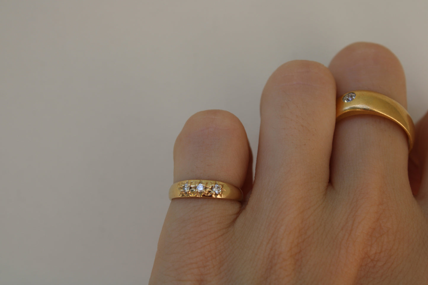 Inspired by a sweet, timeless vintage pinky ring. Three adorable diamonds starset into a perfectly stackable everyday gold ring. Solid 10k recycled gold (hallmarked) - 3 VS1 lab grown diamonds, 2mm diameter (emerald pricing available upon request.)