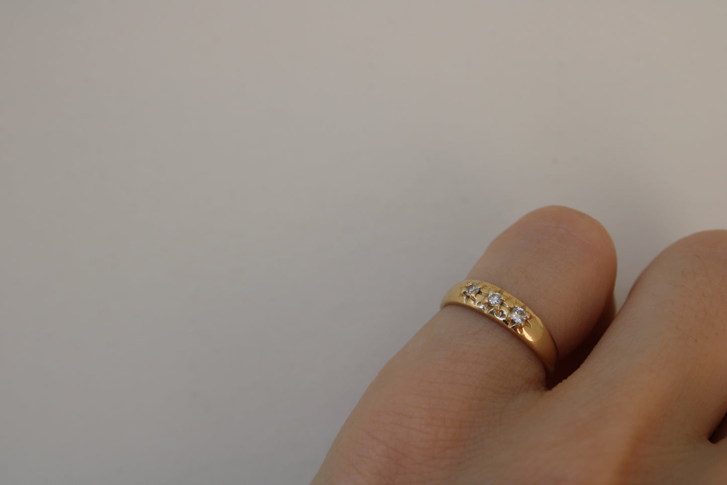 Inspired by a sweet, timeless vintage pinky ring. Three adorable diamonds starset into a perfectly stackable everyday gold ring. Solid 10k recycled gold (hallmarked) - 3 VS1 lab grown diamonds, 2mm diameter (emerald pricing available upon request.)