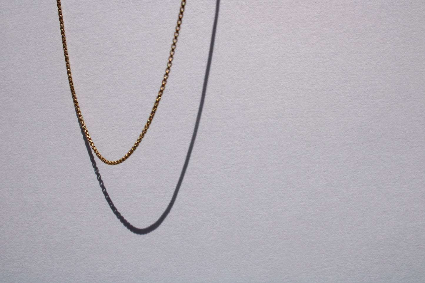 This listing is for the most miniature box chain I carry. Find other sizes here: 1.8mm, 2.6mm, 3.8mm Details: - process: I think the box chain is an excellent choice for wearing alone, layering, or with any charm - large or small. - materials: 14k yellow gold; sturdy lobster clasp - dimensions: 1.4mm links, 18" chain length - all measurements are approximate