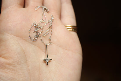 The *only* white gold necklace I have in my current collection. This beautifully delicate cable chain is balanced with an expertly set colorless CZ pendant.  Details: - process: I found this chain as part of an estate sale I was exploring.  - materials: 14k solid white gold (hallmarked) + CZ pendant (20mm long x 5mm wide)