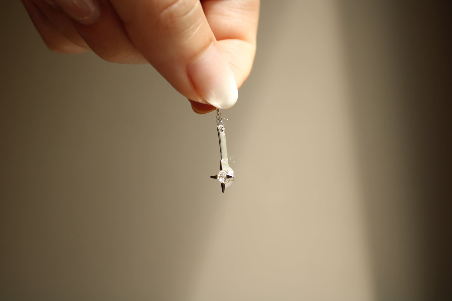 The *only* white gold necklace I have in my current collection. This beautifully delicate cable chain is balanced with an expertly set colorless CZ pendant.  Details: - process: I found this chain as part of an estate sale I was exploring.  - materials: 14k solid white gold (hallmarked) + CZ pendant (20mm long x 5mm wide)
