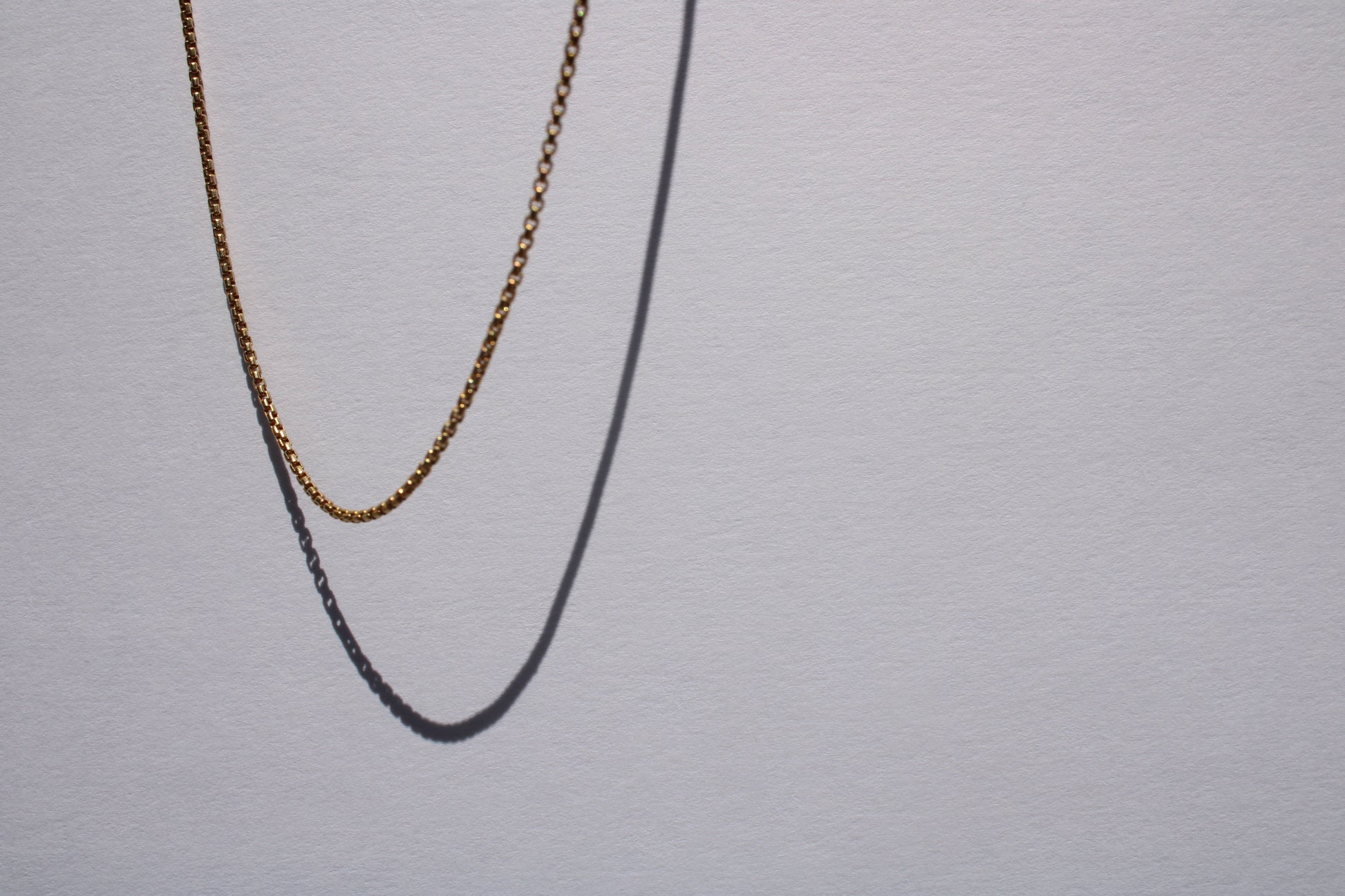 This listing is for the most miniature box chain I carry. Find other sizes here: 1.8mm, 2.6mm, 3.8mm  Details:  - process: I think the box chain is an excellent choice for wearing alone, layering, or with any charm - large or small.&nbsp; - materials: 14k yellow gold; sturdy lobster clasp - dimensions: 1.4mm links, 18" chain length - all measurements are approximate