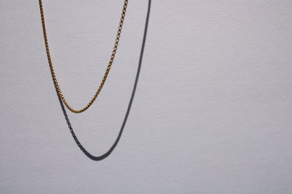 This listing is for the most miniature box chain I carry. Find other sizes here: 1.8mm, 2.6mm, 3.8mm  Details:  - process: I think the box chain is an excellent choice for wearing alone, layering, or with any charm - large or small.&nbsp; - materials: 14k yellow gold; sturdy lobster clasp - dimensions: 1.4mm links, 18" chain length - all measurements are approximate