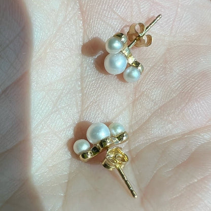 Six lustrous freshwater cultured pearls set in 14k gold. The largest pearl is 4mm and is hugged by two 3mm pearls. Earring posts have two friction groves to provide extra security and durability to hold the earring backs in place.